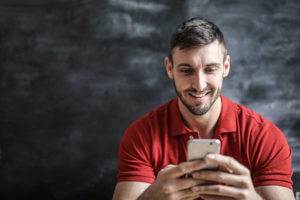 Online Dating Advice - Man Happy On Phone